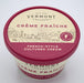 Container of Vermont Creamery Crème Fraîche French-style cultured cream with a red lid and simple farm-themed illustrations on the label.