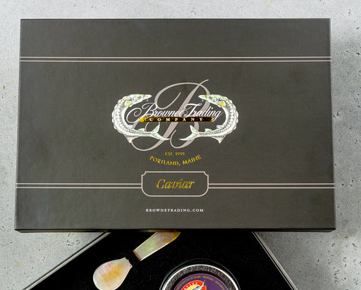 black gift box lid with a white logo