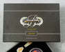 black gift box lid with a white logo