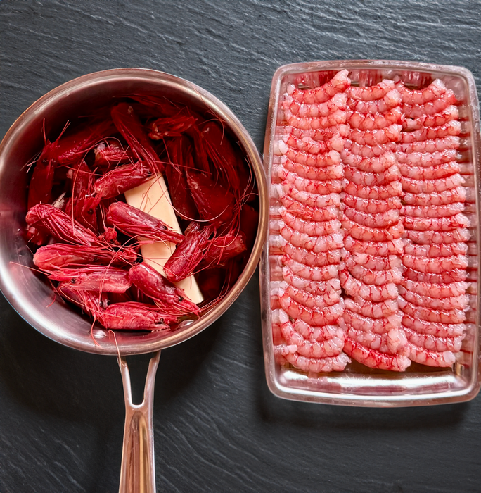Fresh Gambero Rosso prawns with heads intact, displayed by Browne Trading Company for seafood enthusiasts.
