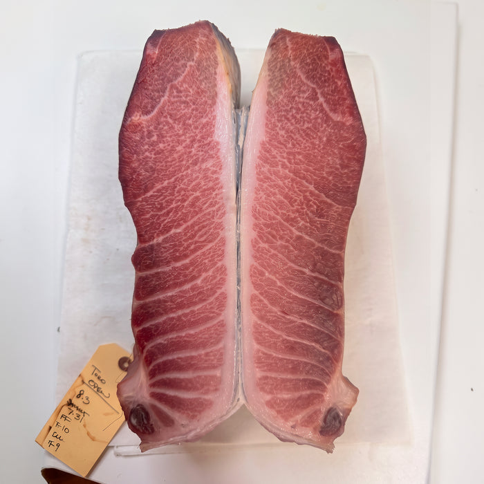 Two cross sections of Dry Aged Tuna Toro showing the deepened color from the aging process 