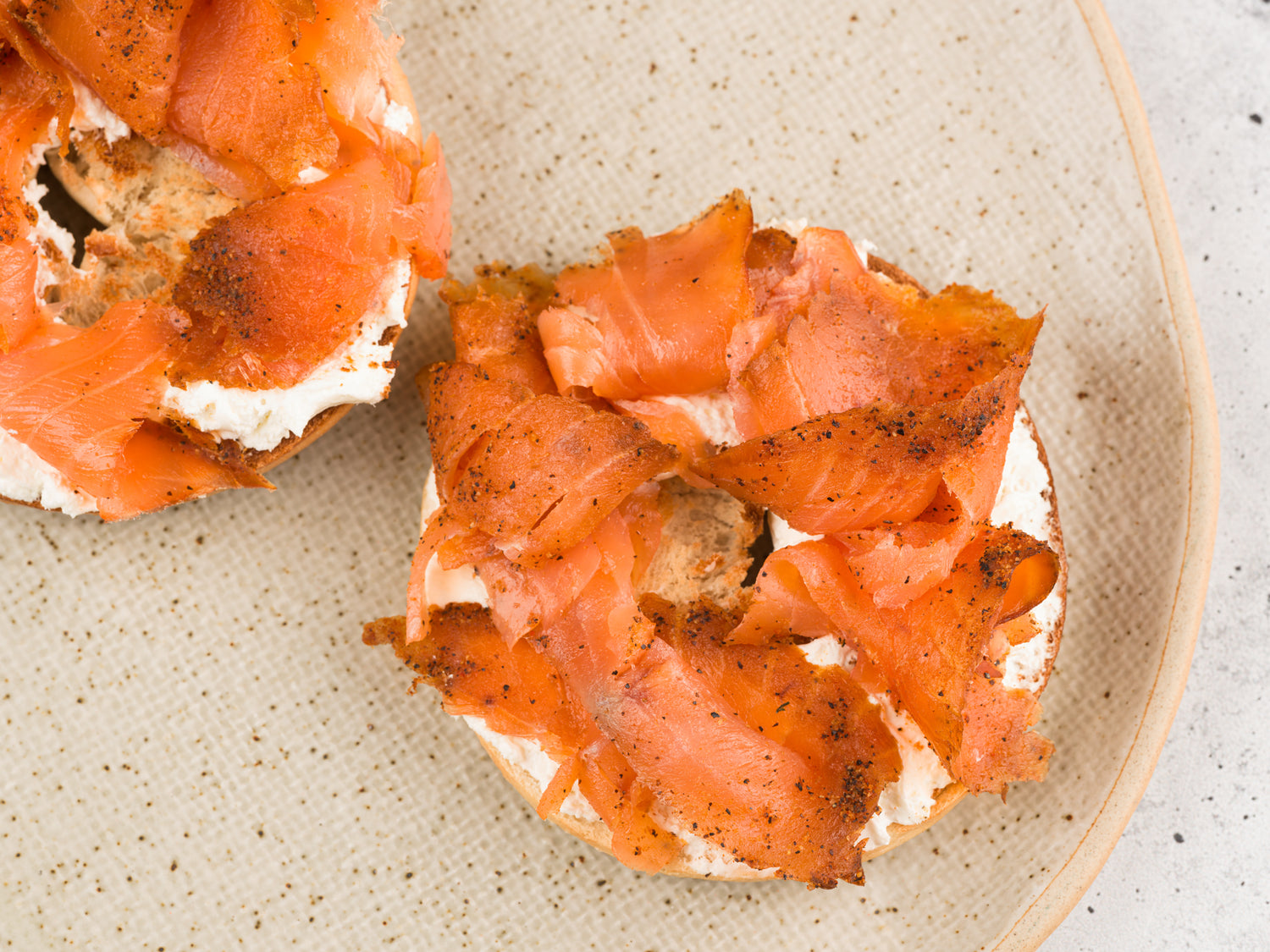 Sliced smoked salmon retail pack from Browne Trading Company with pastrami-style seasoning, displayed in clear packaging.