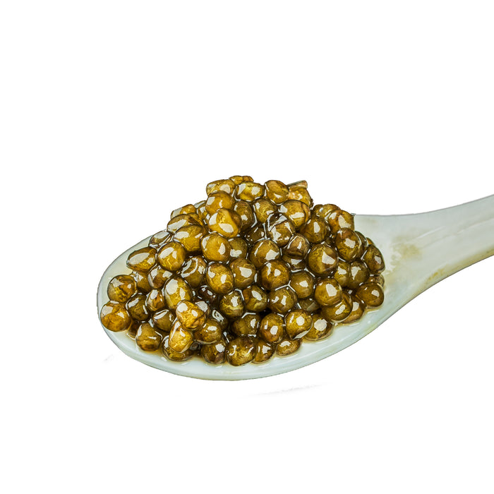 Spoonful of caviar on a white background