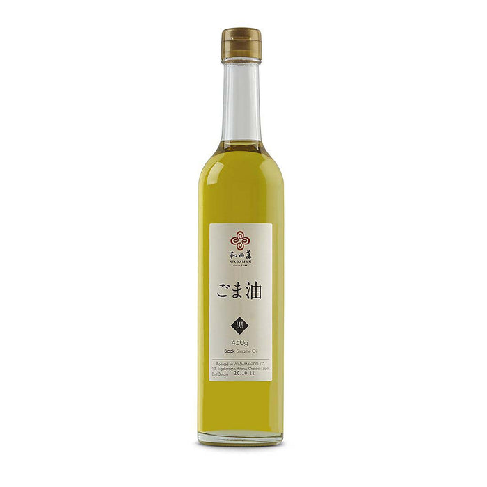 Wadaman black sesame oil bottle, 500ml, front view showing the dark amber liquid in a clear glass container.