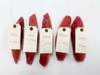 6 collar pieces on a white background, each with a white tag of their weights