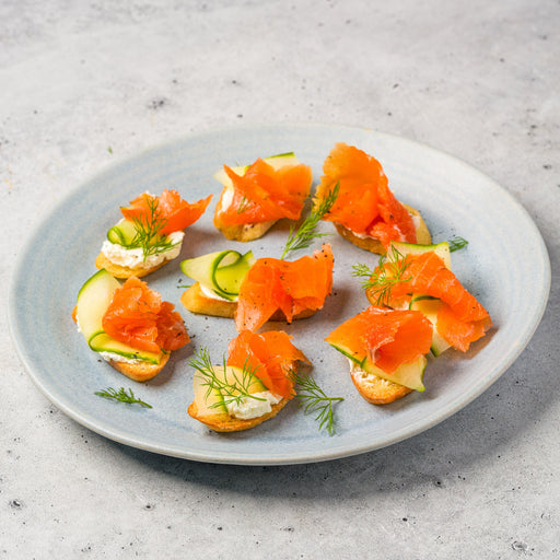 Smoked salmon canapés on a gray plate with a light background