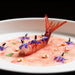 Thinly sliced Gambero Rosso prawns carpaccio from Browne Trading Company, showcasing fresh, delicate seafood slices on a white plate.