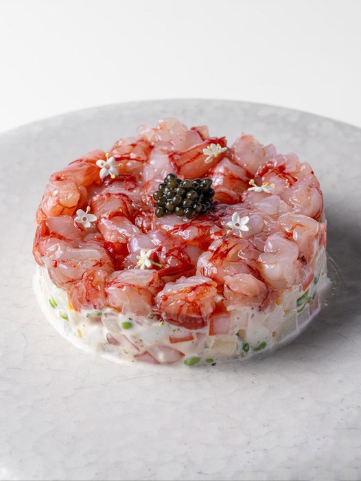 Fresh Gambero Rosso prawns from Browne Trading Company, showcasing vibrant, whole seafood with shells intact.