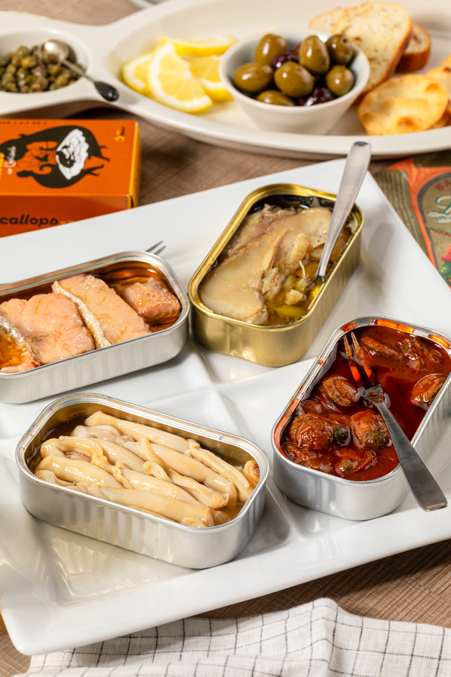 Canned Jose Gourmet Razor Clams in brine, packed in a tin, showcasing the product with a focus on the seafood and branding.