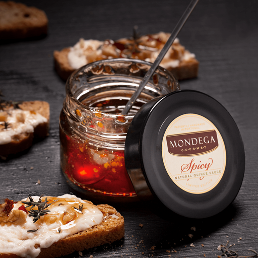 Browne Trading Company Mondega Natural Quince Sauce in a glass jar with a golden label and quince fruit illustration.