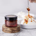Browne Trading Company Mondega natural quince sauce in a glass jar, showcasing its smooth, amber-colored fruit preserve